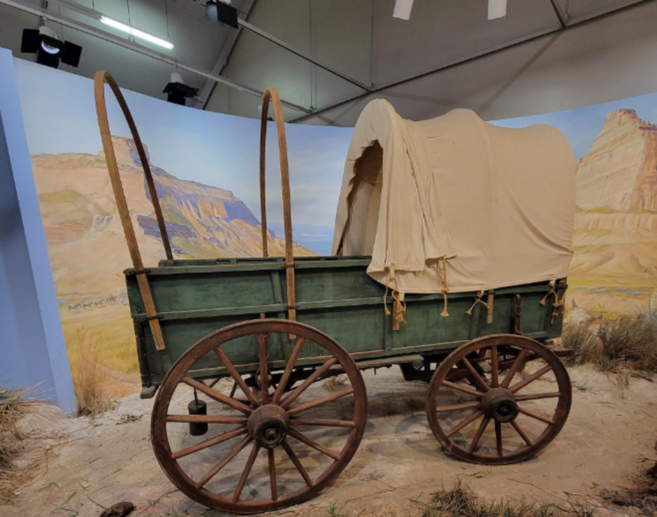 Green prairie schooner covered wagon